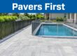 New pool deck pavers in the foreground with a safety fence and temporary mesh barrier.