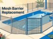 A pool fence shows a torn, sagging panel beside a secure replacement.