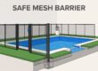 Pool fence on artificial turf with an anchored post and self-closing gate.