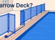 A blue mesh fence and inward-swinging gate border a narrow pool deck.