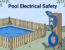 A GFCI outlet and secured cord sit safely away from a blue pool.