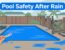 A hand checks a blue pool after rain near a fallen palm frond and damaged gate.